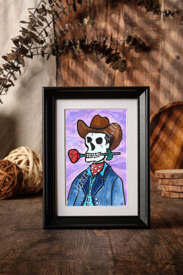 A cowboy with nothing to lose—literally. This dapper skeleton leans easy in the saddle, a flirty pink scarf with white hearts tied just right, and a cheeky rose clenched between his teeth. Hollow eyes might not wink, but the tilt of his hat says it all.